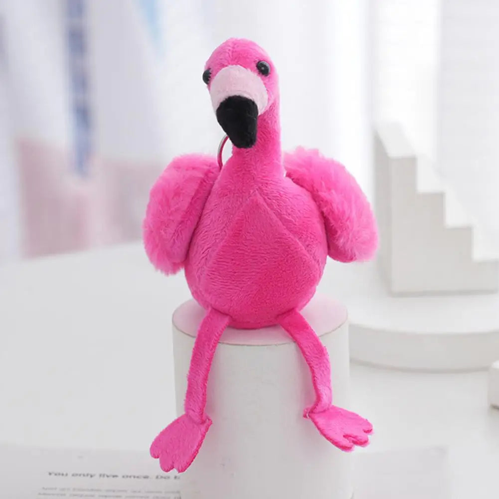 Handmade flamingo keychain charm in pink sitting pose showing full body plush construction detail