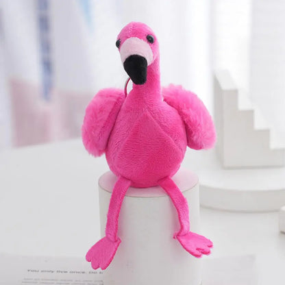 Handmade flamingo keychain charm in pink sitting pose showing full body plush construction detail