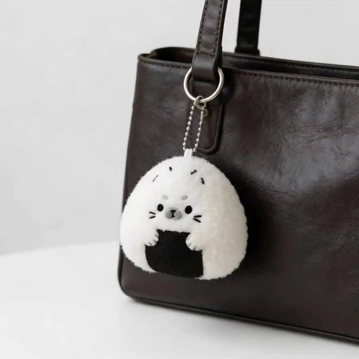 Handmade kawaii plush keychain on white background showing full shape