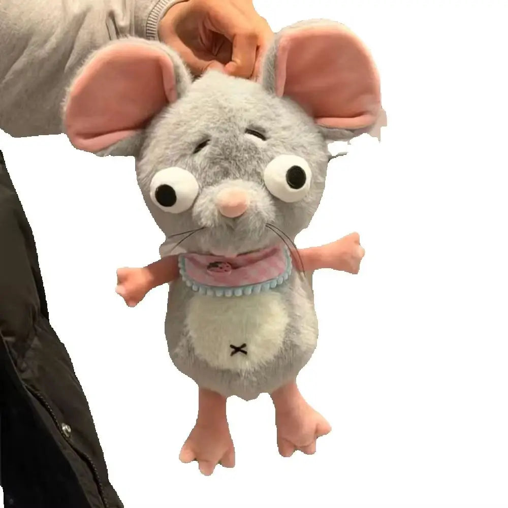 Handmade mouse stuffed toy displayed beside a monitor as a gaming desk decoration
