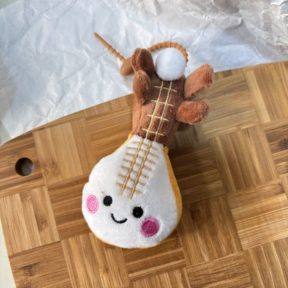 Handmade pipa plush keyring hanging on bag zipper pull lifestyle shot
