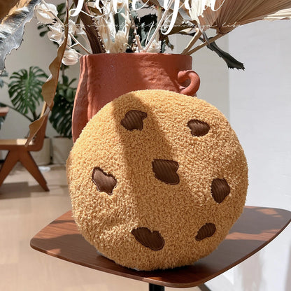 Handmade plushie cookie stuffed toy displayed on a bedroom shelf