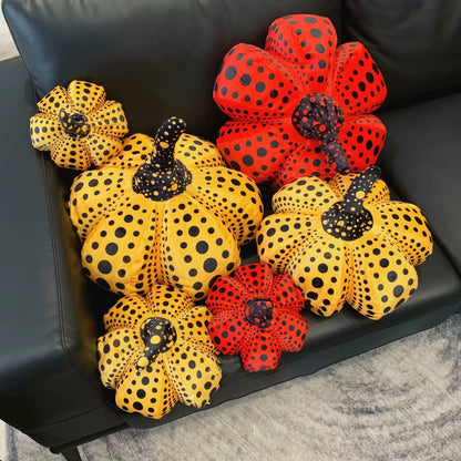 Handmade pumpkin stuffed toy with bold spotted dot pattern on rounded gourd form
