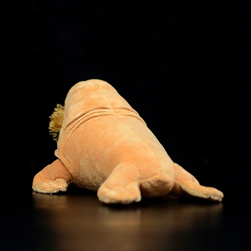 Handmade walrus plush placed next to ruler showing 30cm size