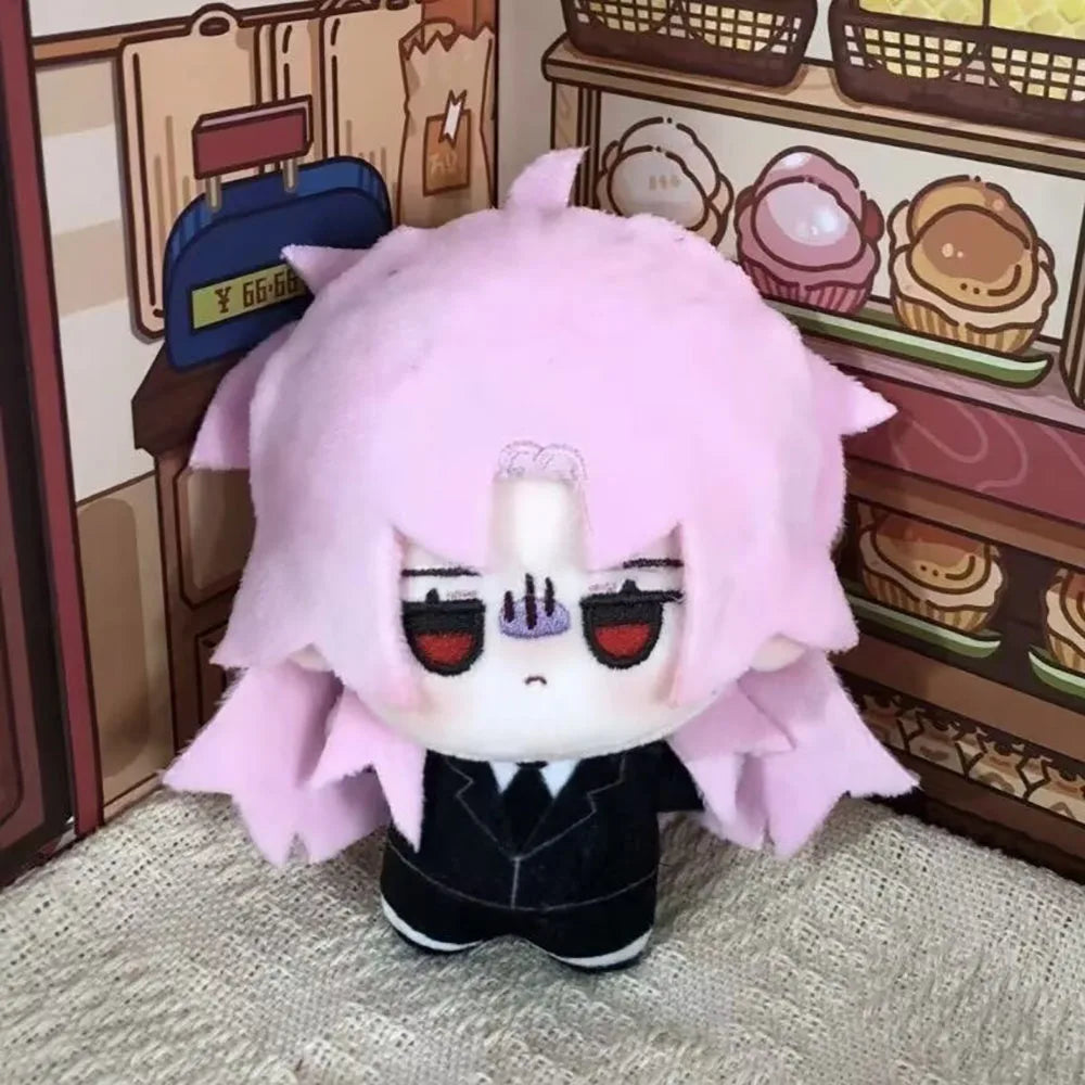 Hatsutori and Seodore Riddle plush displayed together on a shelf
