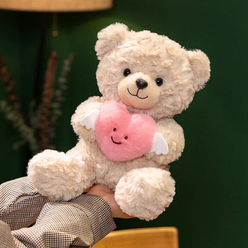 Heart teddy bear gift white plushie being held in hands size reference