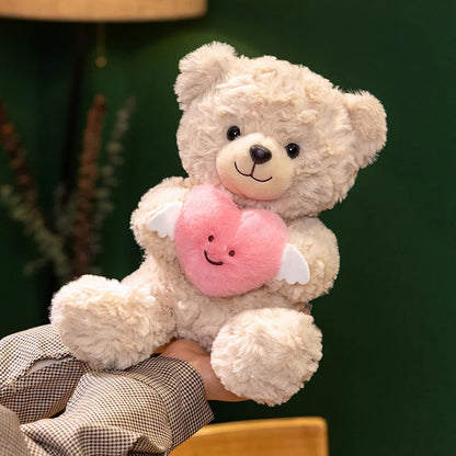 Heart teddy bear gift white plushie being held in hands size reference