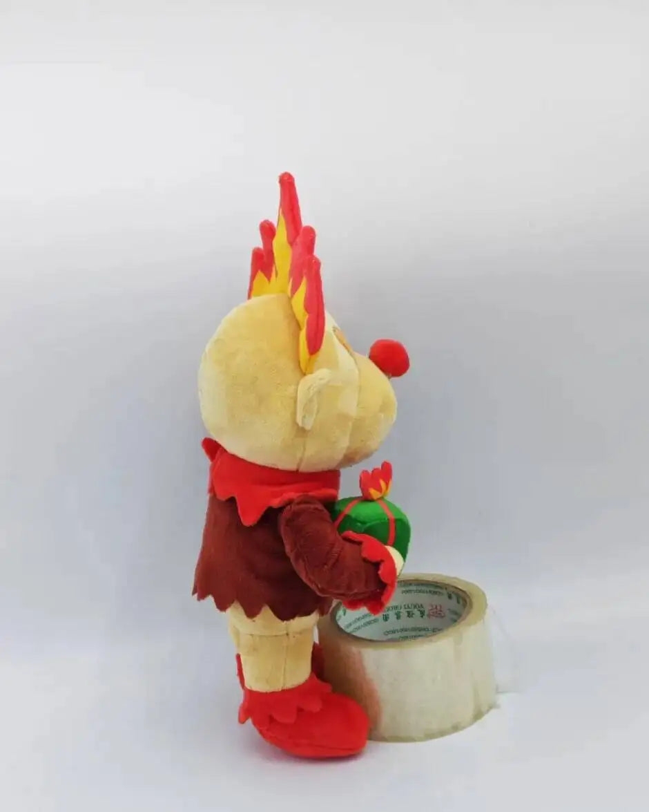 Heat Miser plush beside a ruler showing 30cm size reference for scale