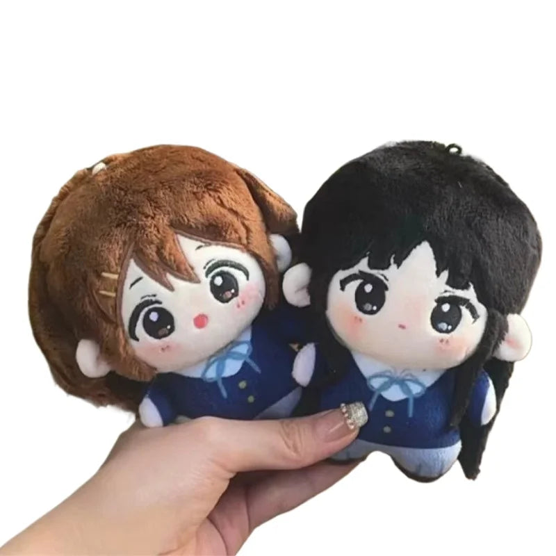 Hirasawa Yui and Akiyama Mio plush duo displayed side by side K-On anime