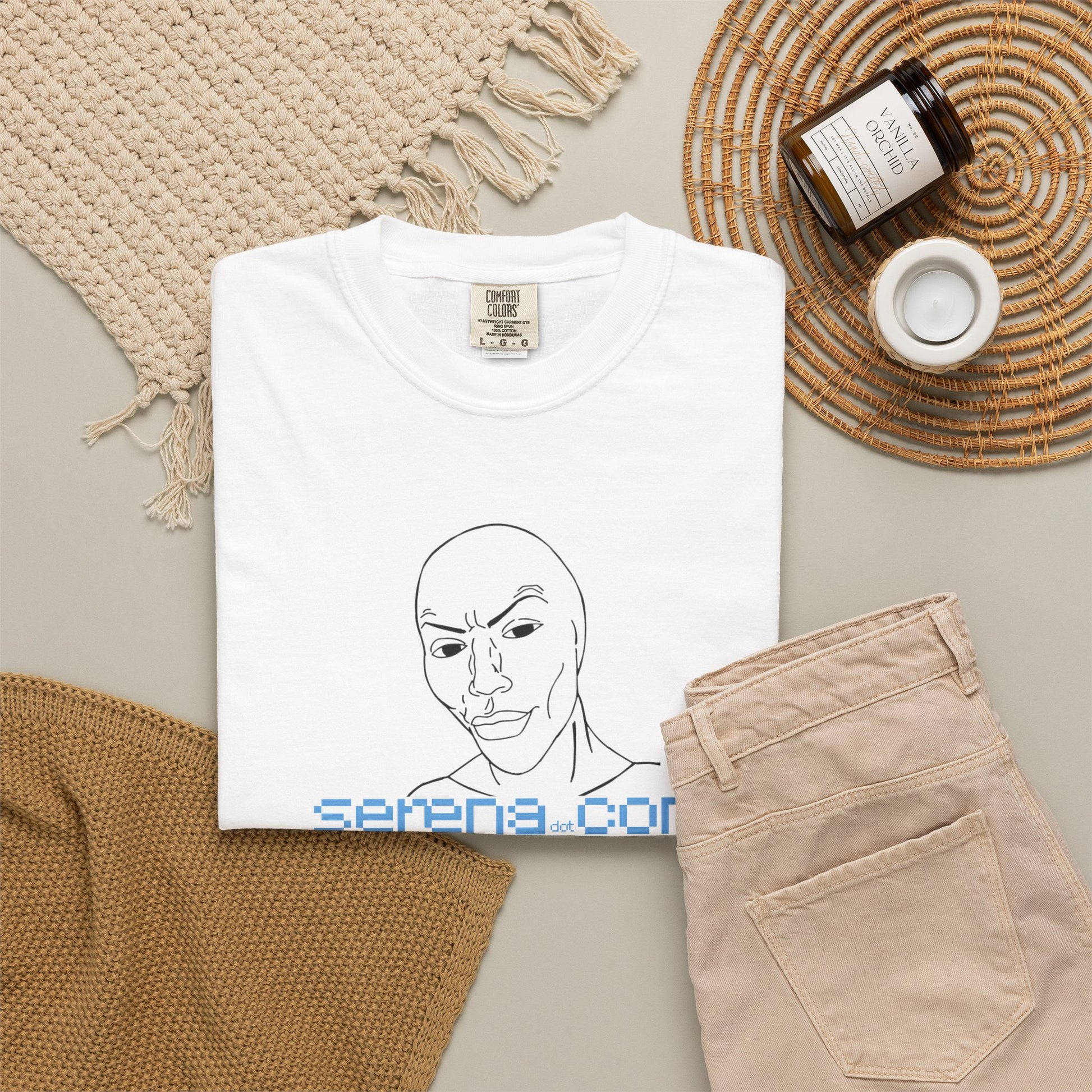 Indie designer graphic tee worn creative studio setting casual styling
