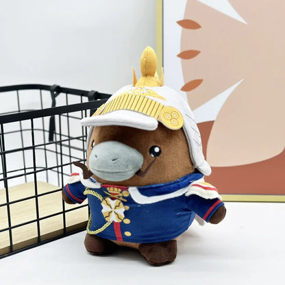 Kaiser plush toy beside gaming keyboard desk setup