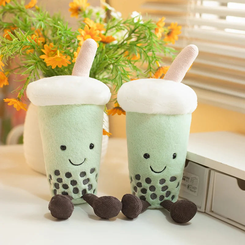 Kawaii bubble tea plush toy with smiley face and tiny legs on white background
