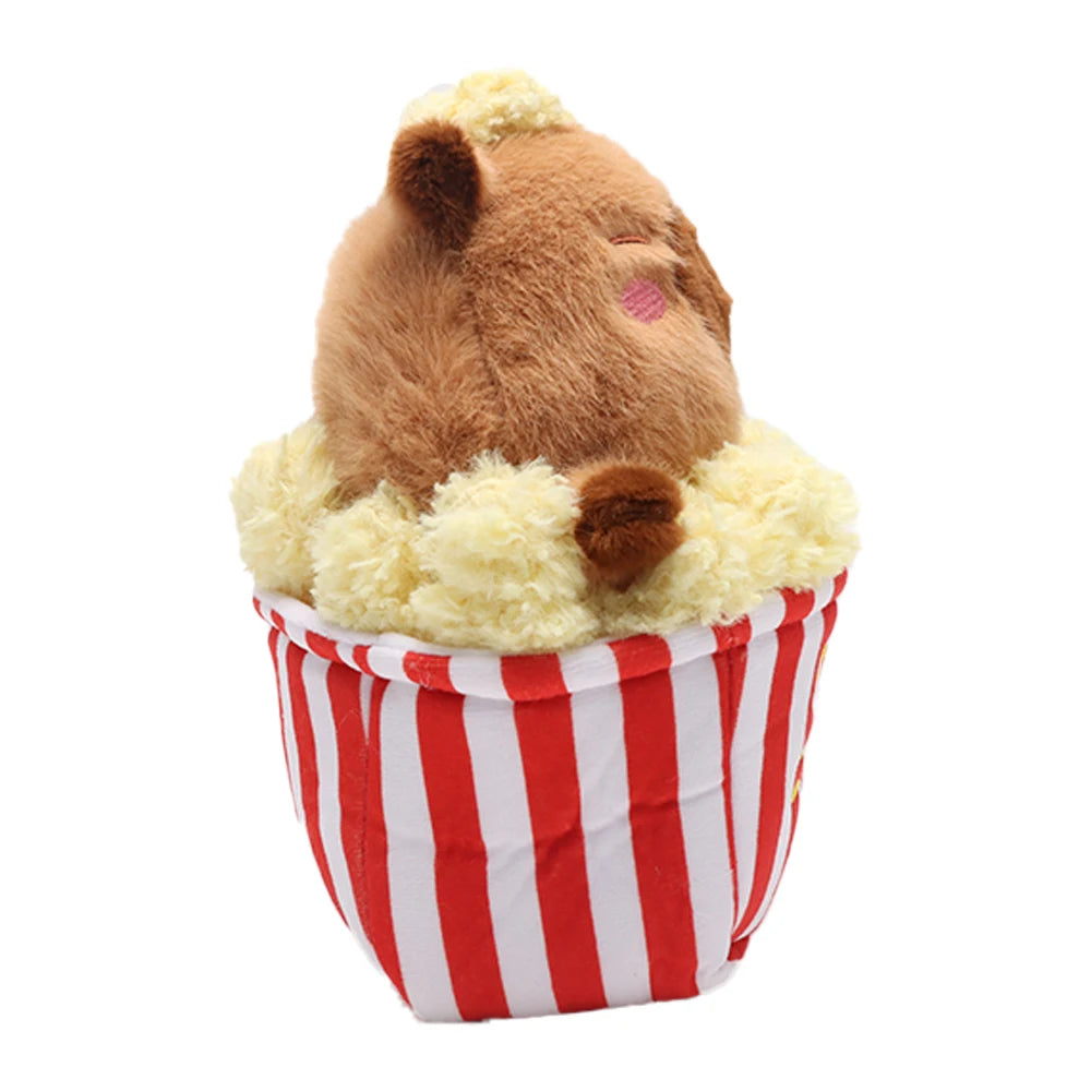 Kawaii capybara plush toy in popcorn bucket close-up detail