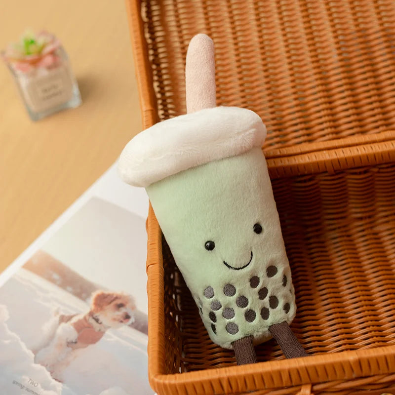 Kawaii collectible toy boba plush flat lay with matcha powder and accessories