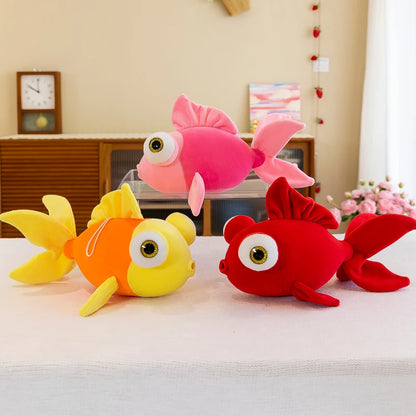 Kawaii goldfish stuffed animal with oversized bulging eyes, pink variant