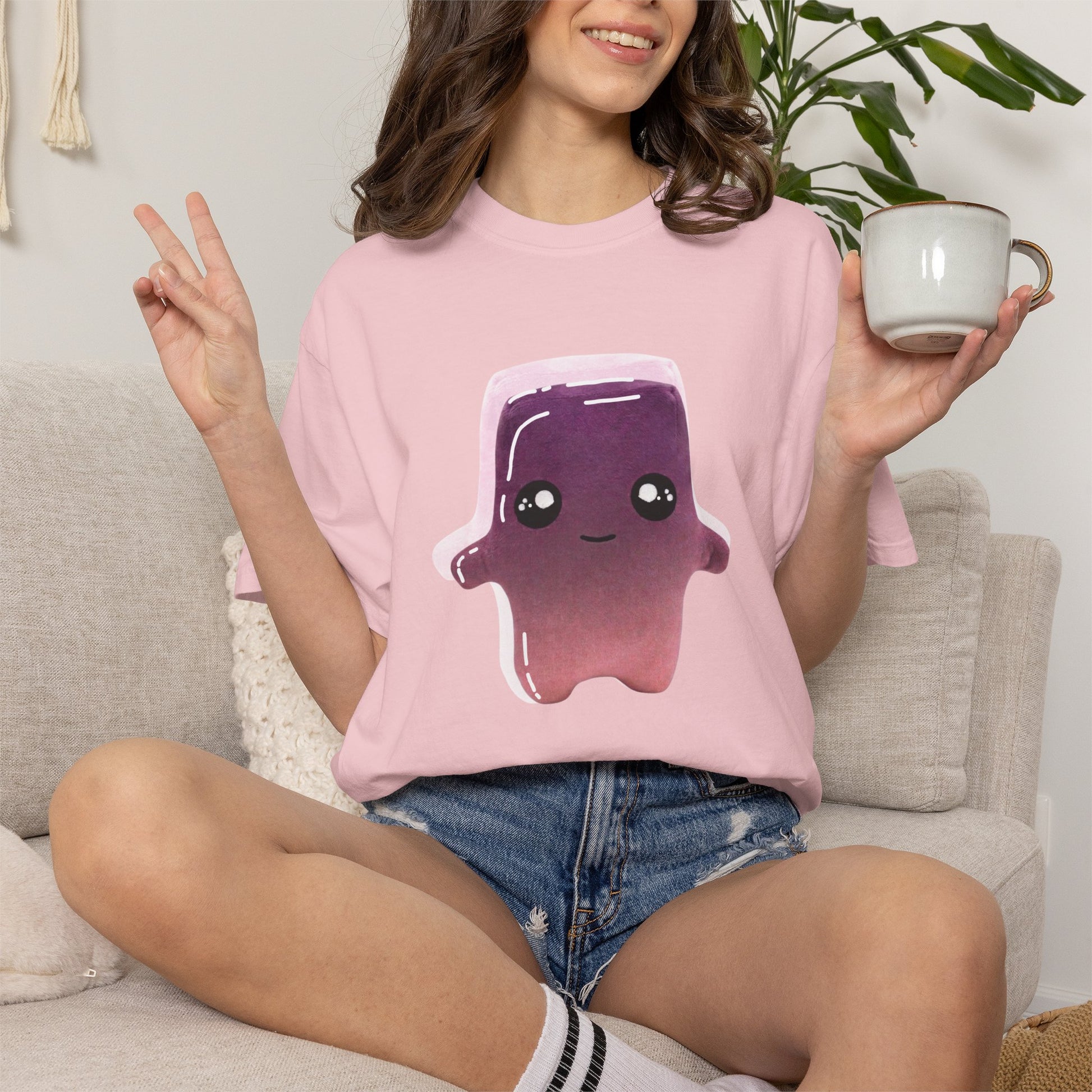 Kawaii graphic tee on wooden hanger natural light product photography