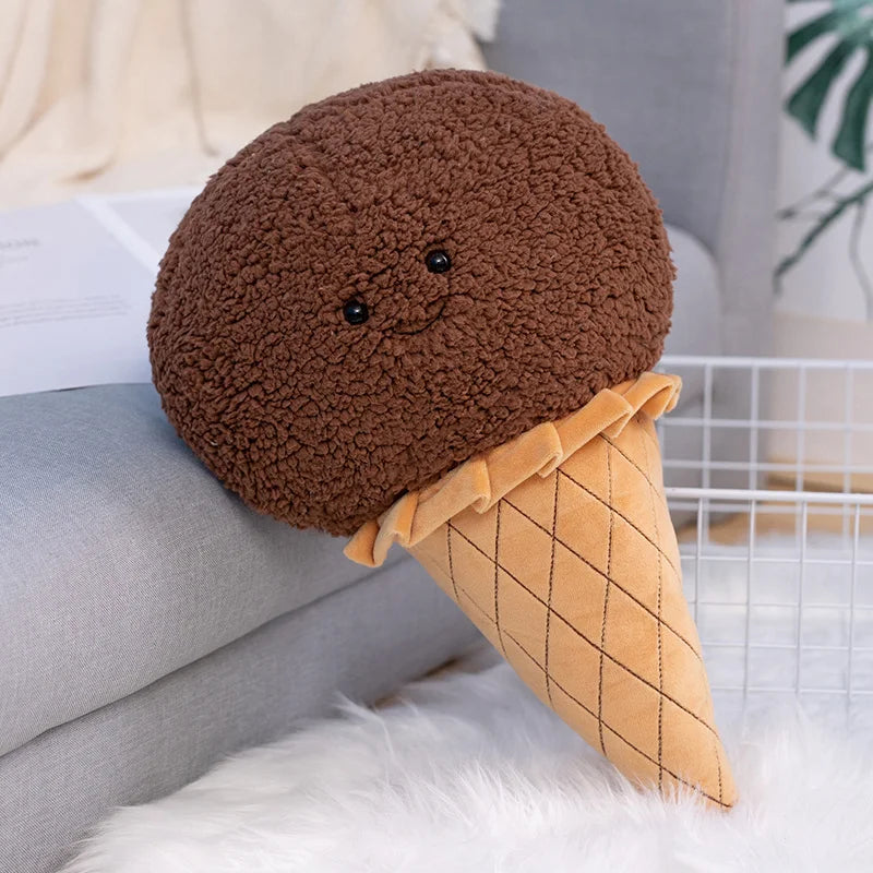 Kawaii ice cream cone plush toy in strawberry pink bouclé fleece propped against bedroom pillows as aesthetic room decor