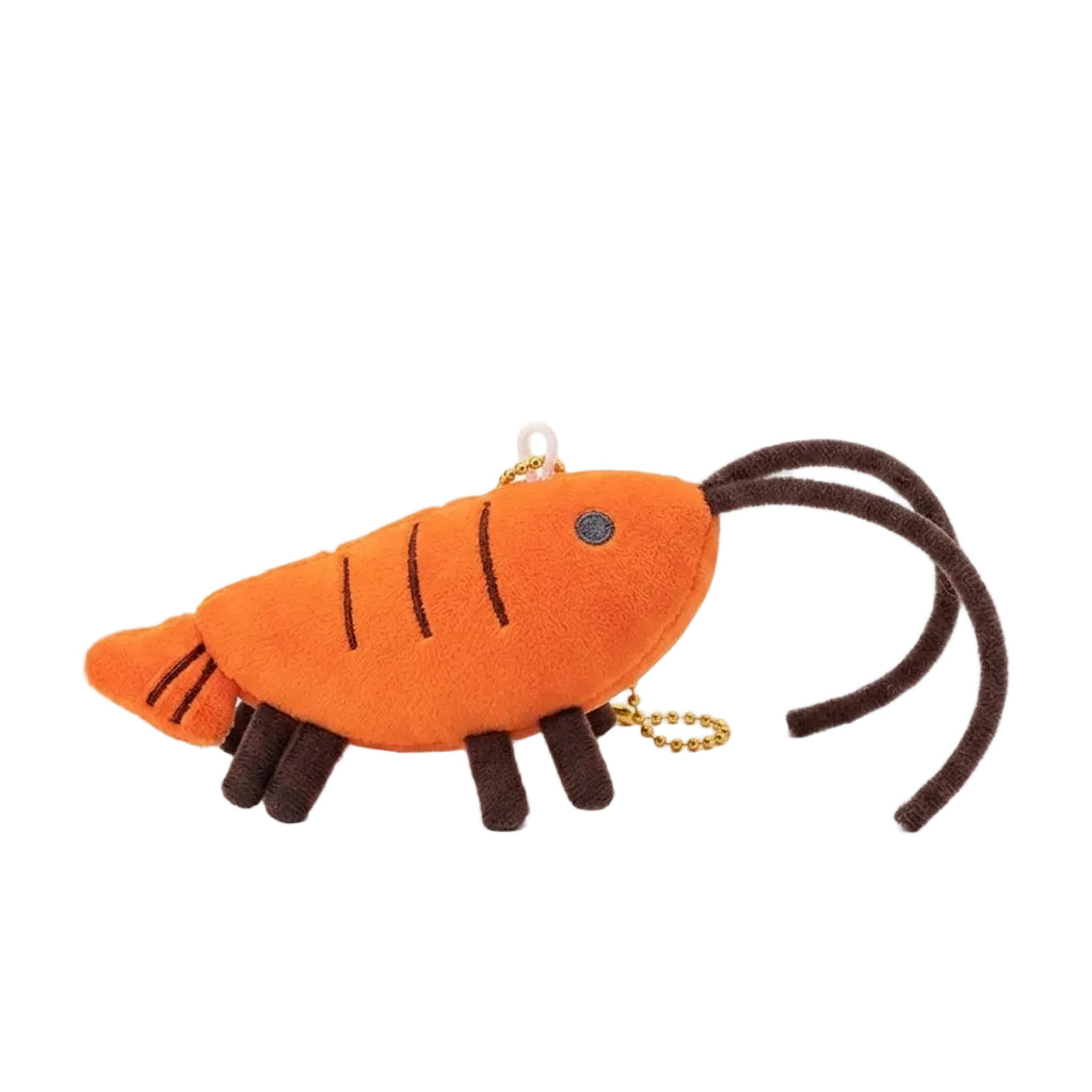Kawaii orange shrimp plushie keychain charm on white background