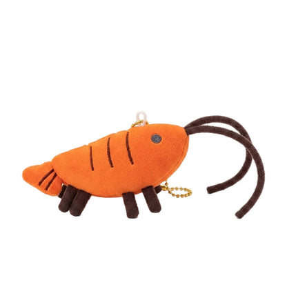 Kawaii orange shrimp plushie keychain charm on white background