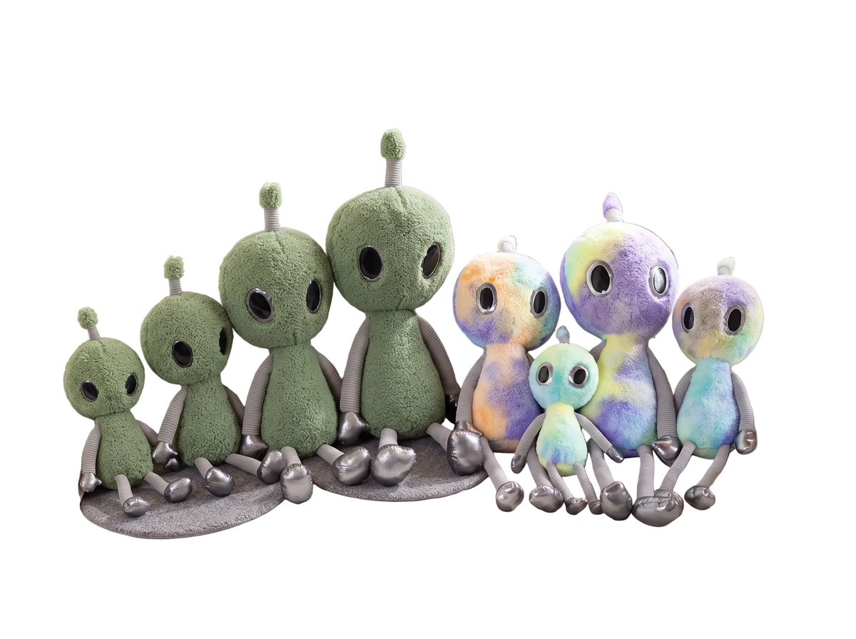 Kawaii pastel alien plush in green with long dangling legs on white background