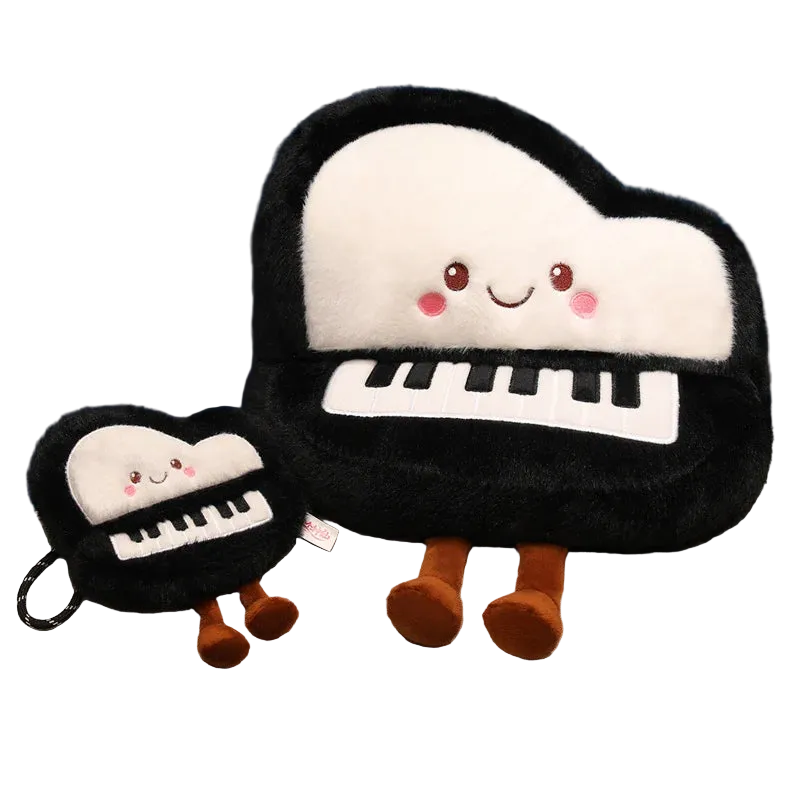 Kawaii piano plush in 33 cm grand piano throw pillow size displayed on a pastel pink bedspread