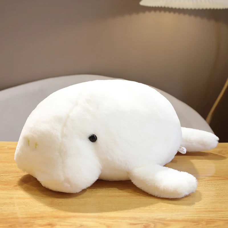 Kawaii plush sea cow dugong toy flat lay ocean themed