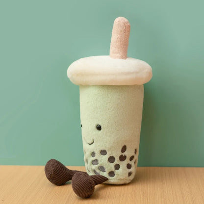 Kawaii stuffed animal matcha boba toy side angle showing dangling leg and straw detail
