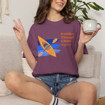 Kayaker gift wrapped flat lay featuring the Rapid Runner graphic tee