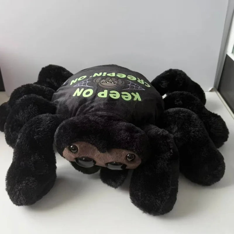 Keep On Creepin On text printed on back of black halloween spider plush