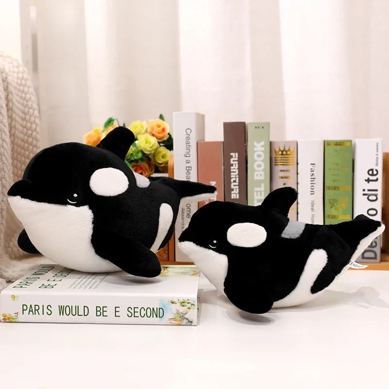 Killer whale plush toy detail shot showing double-stitched seams