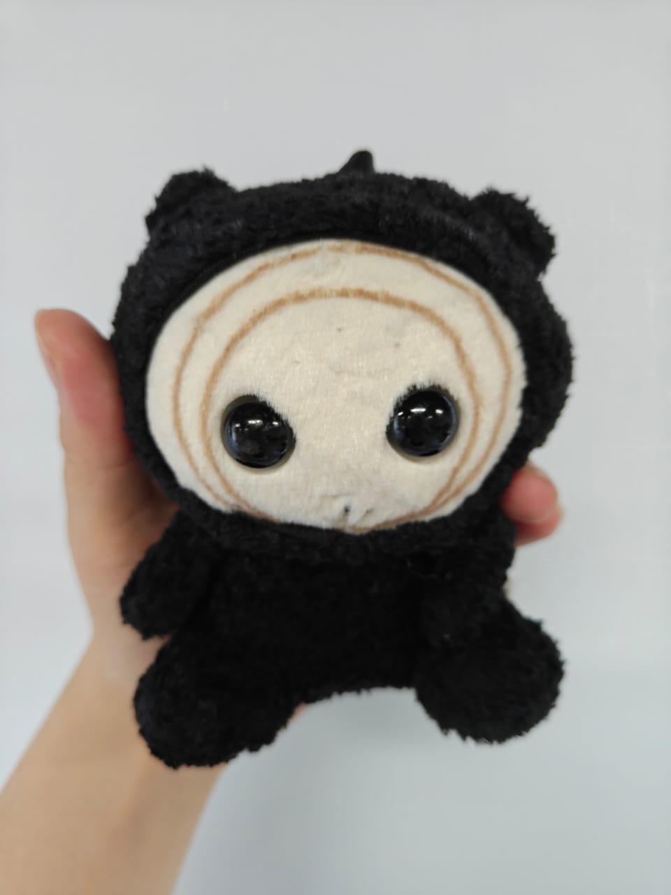 Kkeomeoksali plush 13cm front view, jet black handmade plush with round face and large doll eyes, The East Palace Donggung collectible