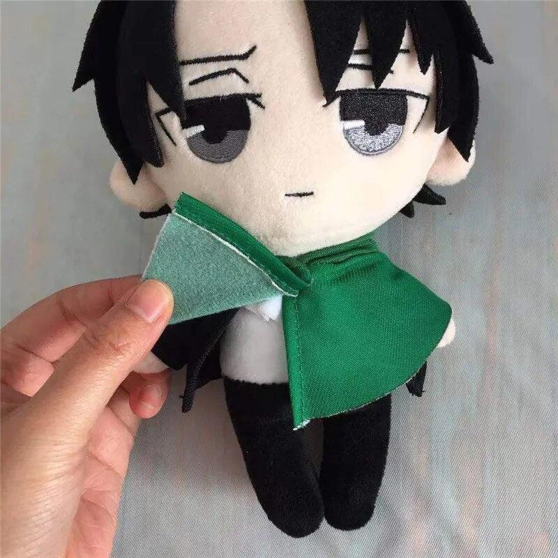 Levi plush with gear flat lay product shot on neutral background, anime plush collectible
