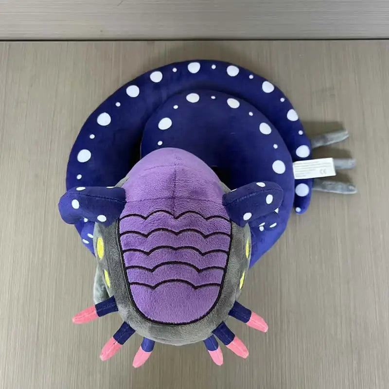Leviathan-inspired plush blueish-black body with bioluminescent markings side view
