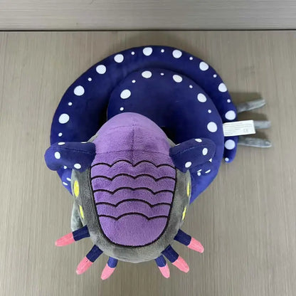 Leviathan-inspired plush blueish-black body with bioluminescent markings side view
