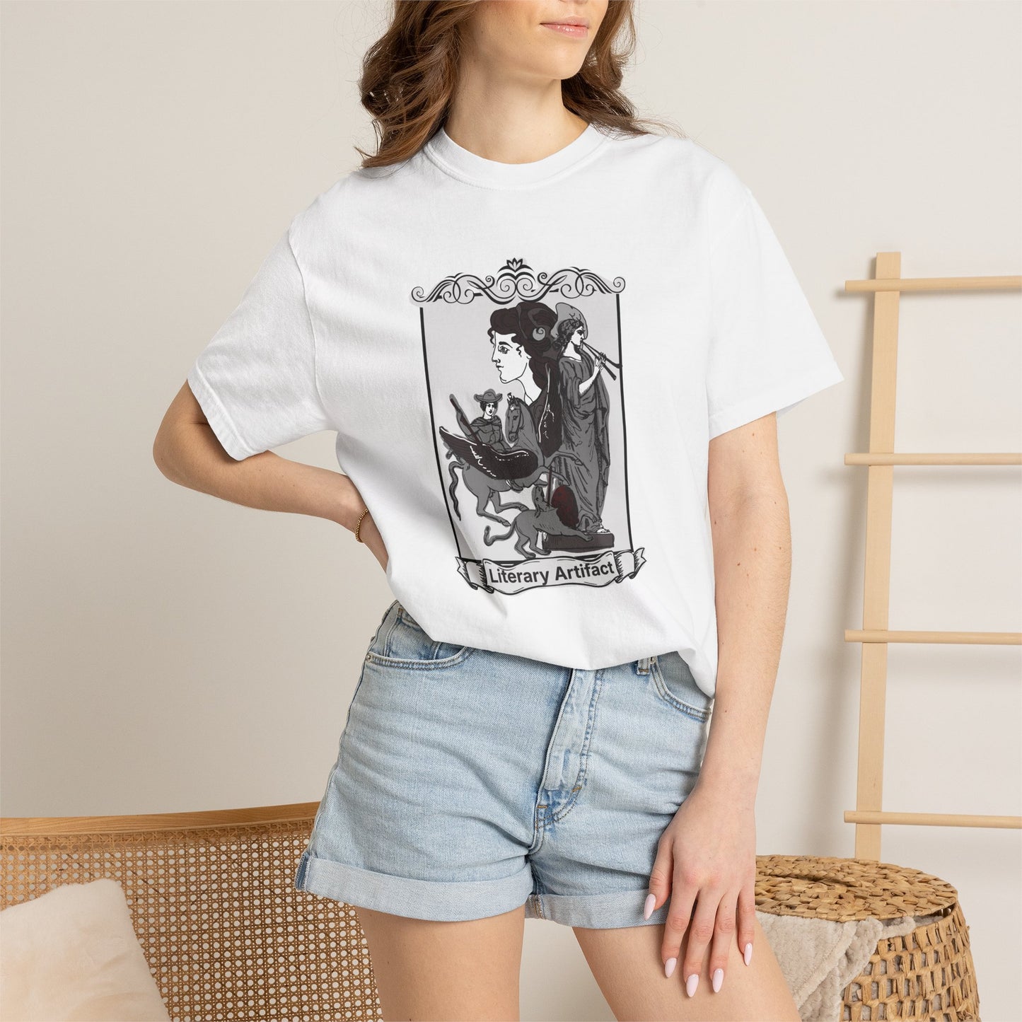 Literary Artifact gothic reader tee shown on a model in a library setting with bookshelves