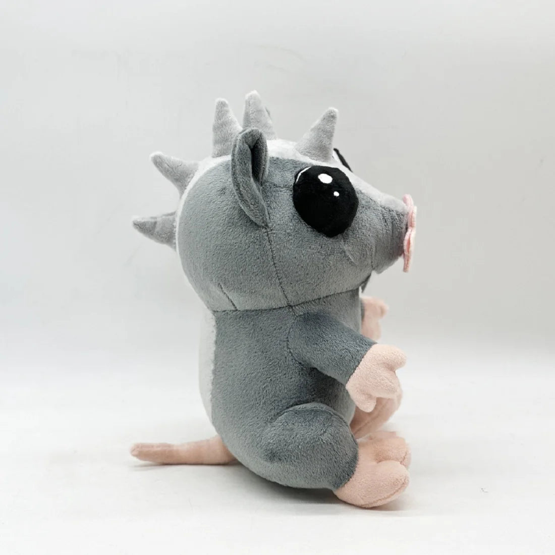 Louie rat stuffed animal side profile close-up
