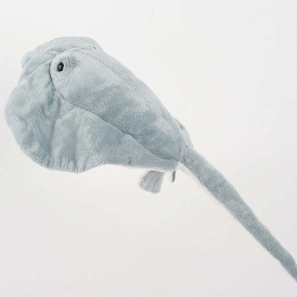 Manta plush toy front view showing cephalic fins and wide body
