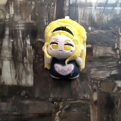 Marina plushie 10cm size reference next to hand for scale