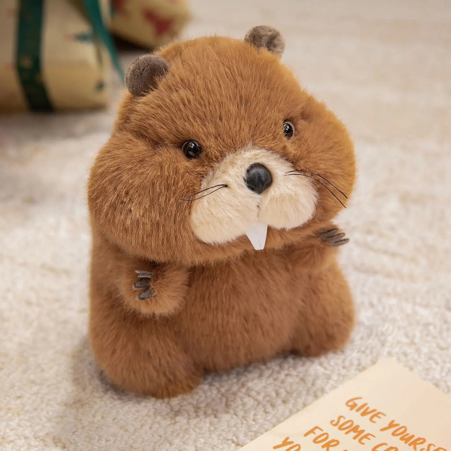 Marmot cuddle buddy plush in both size options shown side by side