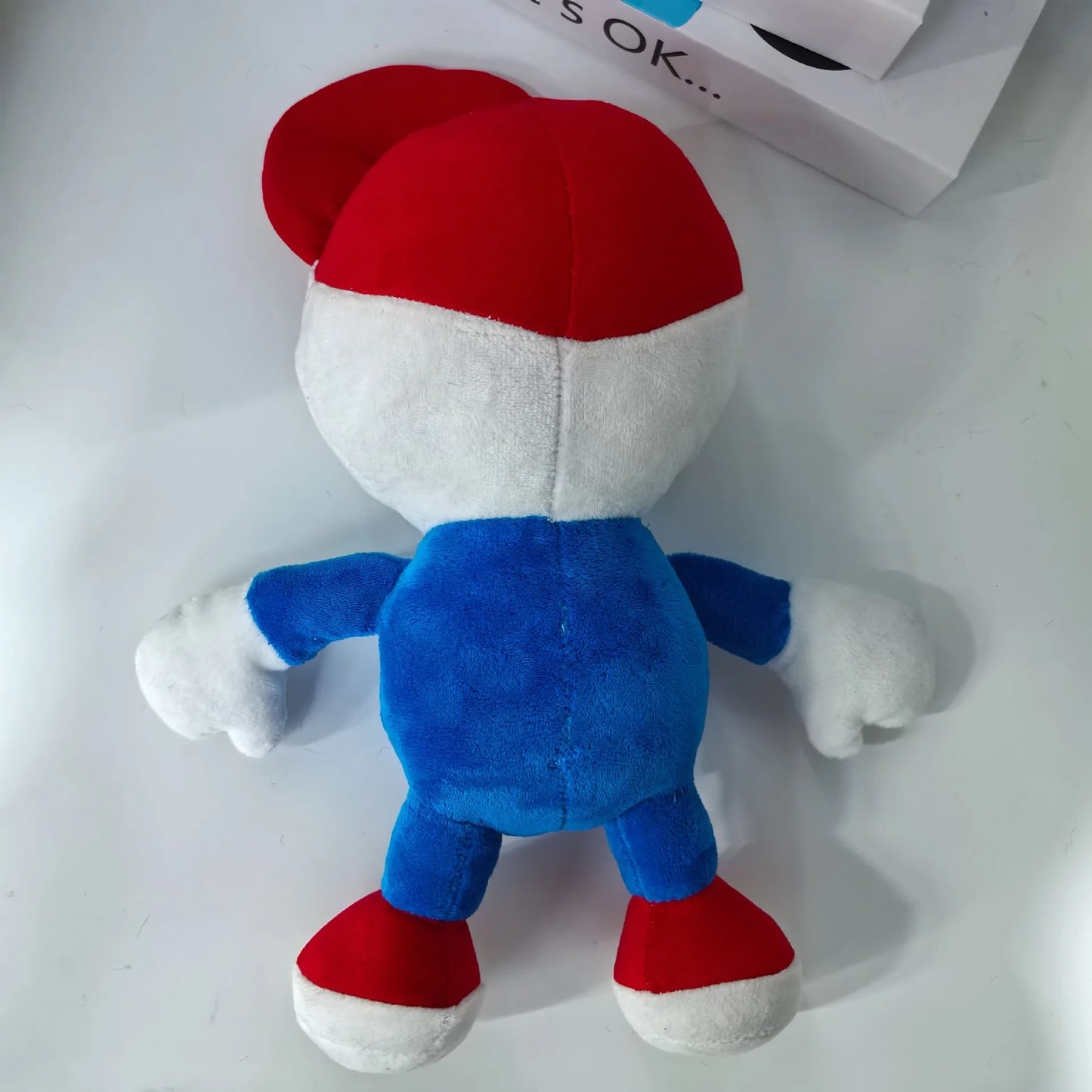 Mellow plushie blue shirt red Velcro shoes floating appendages