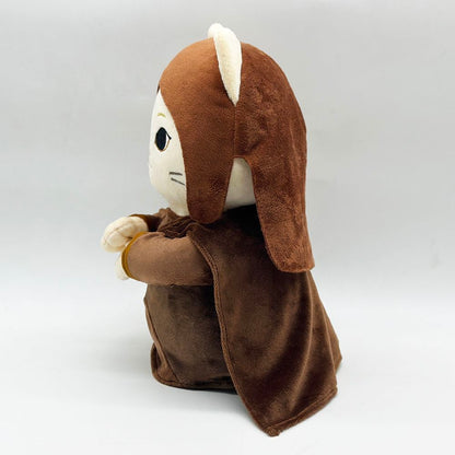 Meow-Na Lisa plush next to a small plant on a desk, novelty cat plush decor
