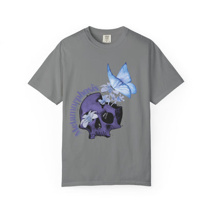 Metamorphosis T-Shirt with curved lettering around a flowering skull design