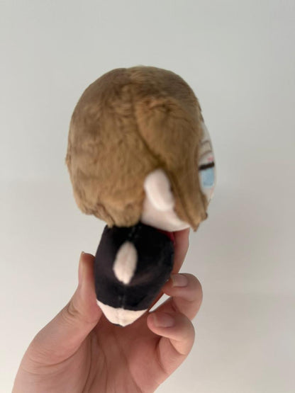 Micah Bell stuffed animal compact fan collectible displayed on gaming shelf

