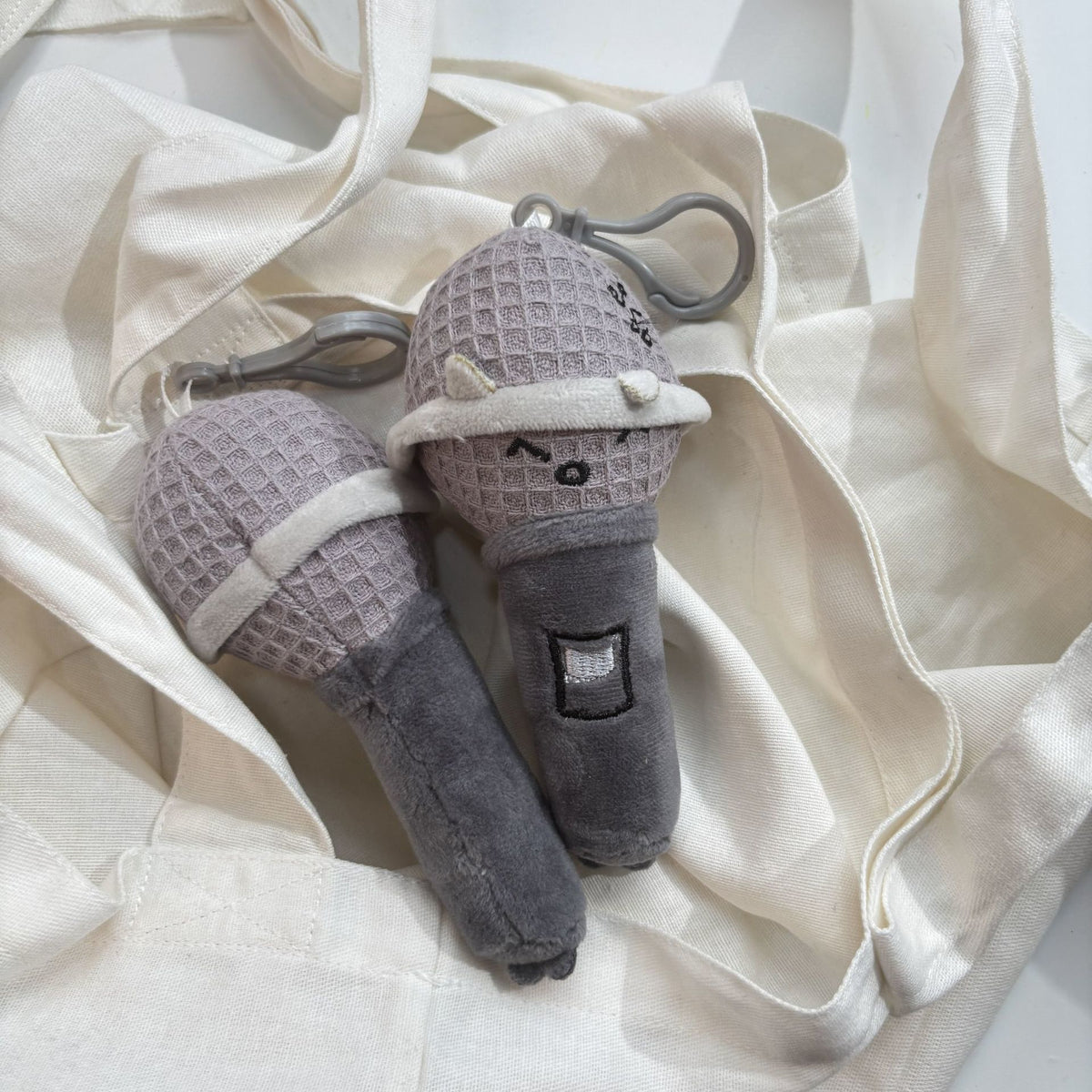 Microphone plushie keychain waffle texture grille detail close up