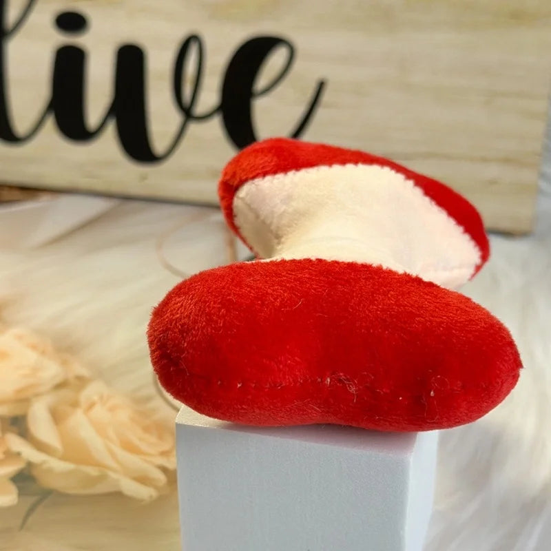 Mini apple plushie with a silver metal keyring attachment