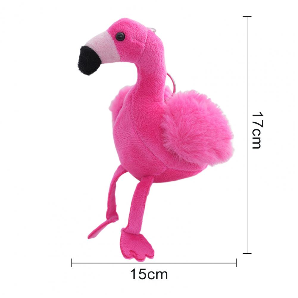 Mini flamingo stuffed animal in baby pink sitting upright showing rounded handmade plush silhouette