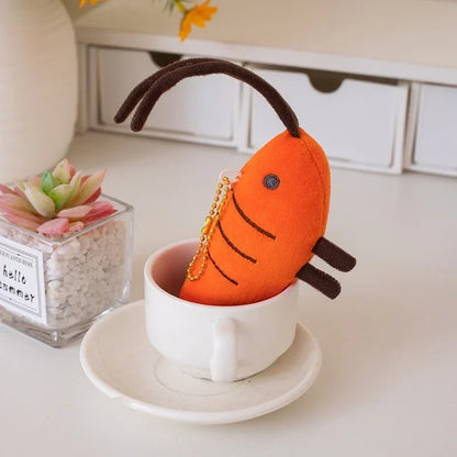 Mini kawaii shrimp plushie with PP cotton filling displayed flat