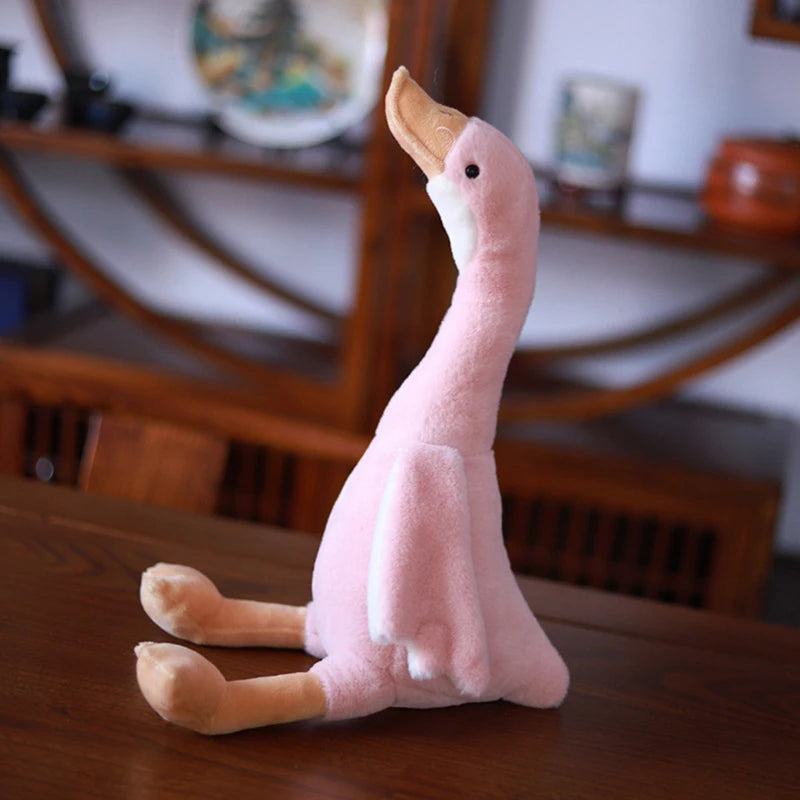Minimalist goose plush doll neutral background top view