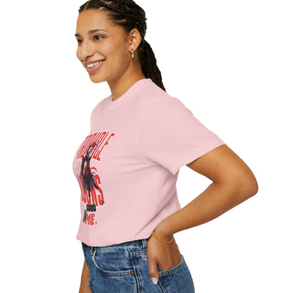 Miss Chiff graphic tee worn by model sitting on steps, relaxed casual pose showing natural garment drape
