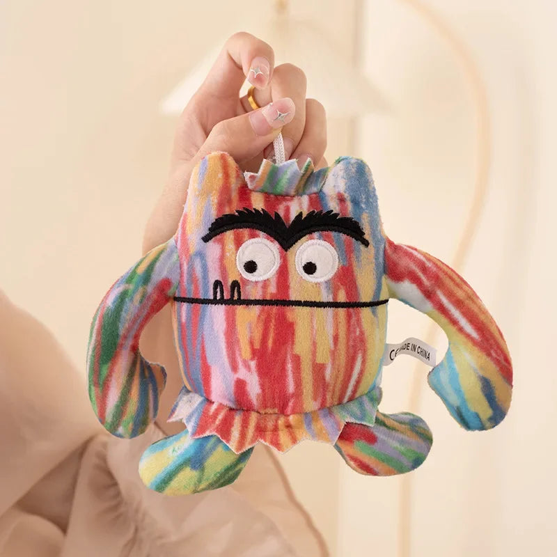Mixed emotions stuffed animal showing all six emotion colors against a neutral background